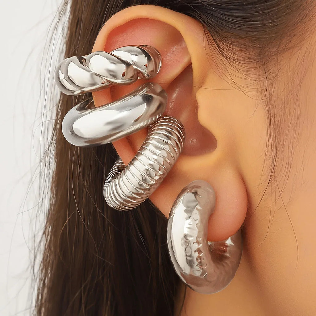 Set of four geometric clip-on earrings in gold and silver finishes for women without pierced ears