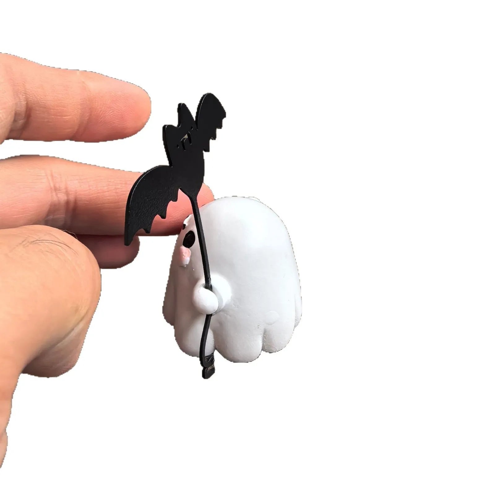 Small resin ghost walking dog statue with a bat, a Halloween decoration.