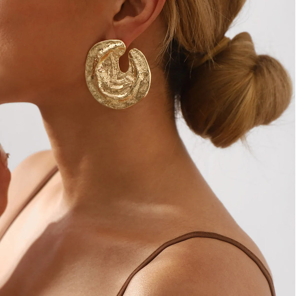 Geometric alloy women's earrings with exaggerated irregular pleated design and concave-convex texture in gold colour