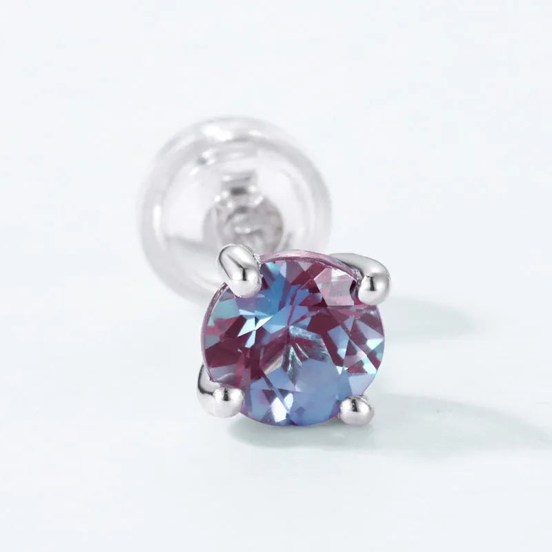 A pair of simple geometric 925 silver ear studs with round cultivated alexandrite stones.