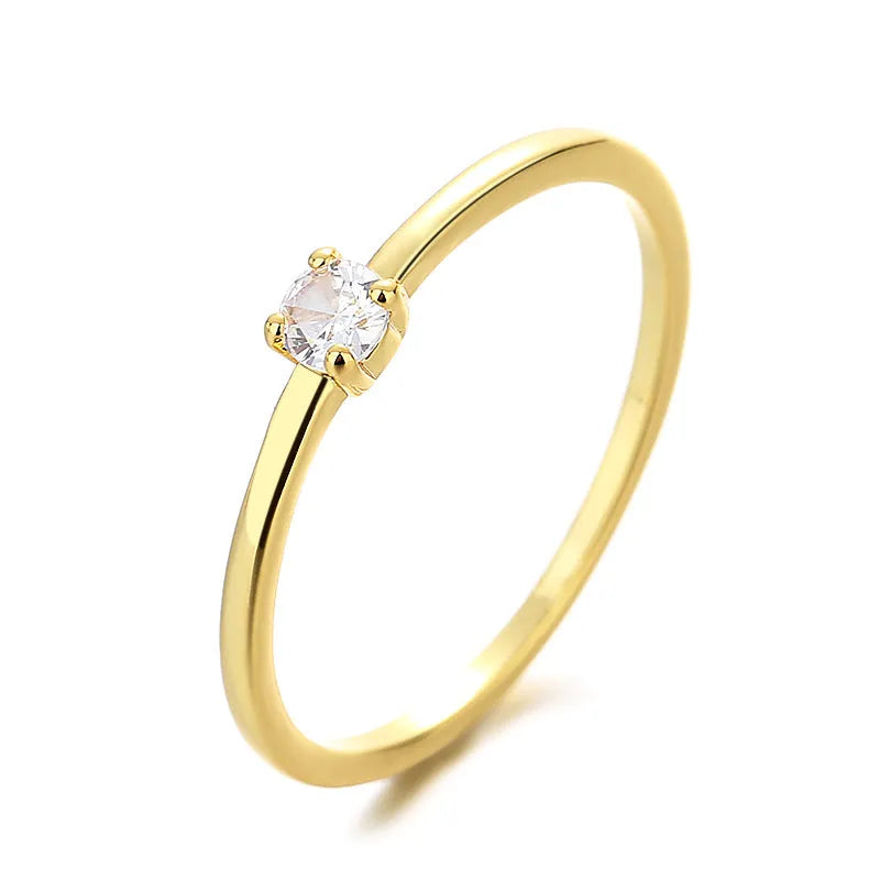 Copper women's ring with twin circle geometric design and a single central diamond, shown in blue.