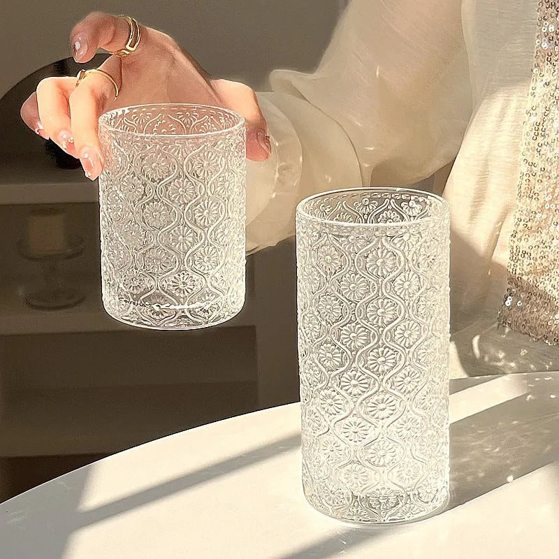 A begonia-carved straight round glass water cup in a solid colour, shown in short 250ml and tall 380ml sizes.