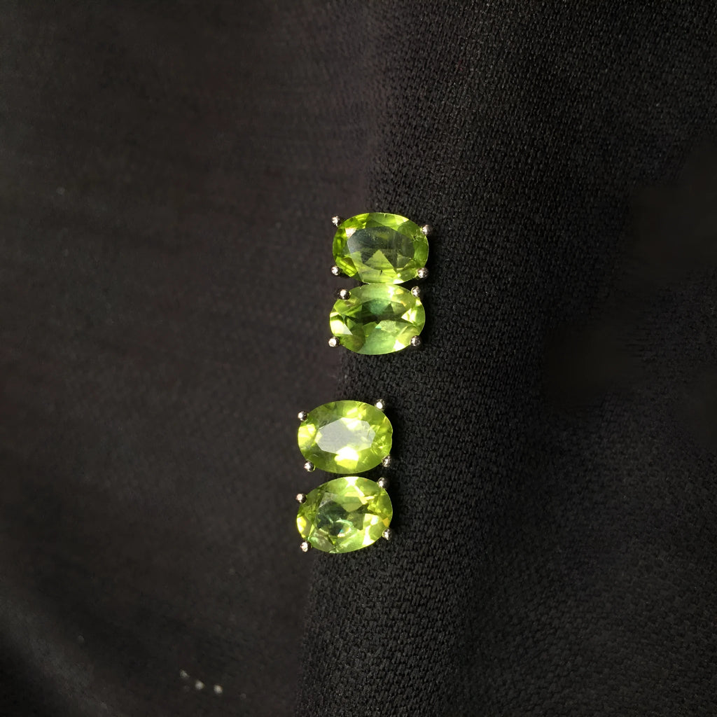 Natural grass green olivine faceted stud earrings in S925 sterling silver setting.