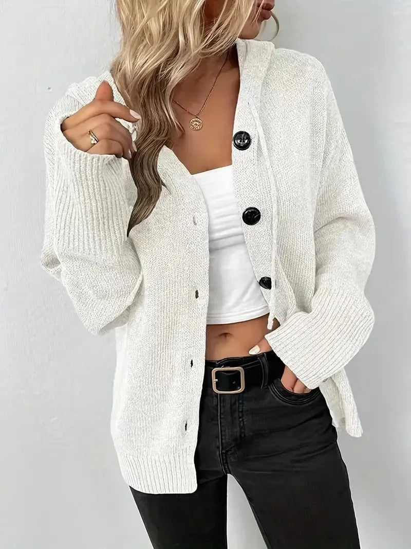 A thick grey hooded cotton cardigan with a raised 3D pattern, shown on a model.