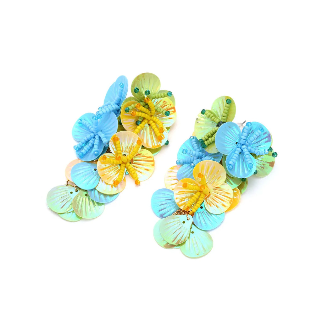 Handmade floral earrings with colourful beads on strings in exaggerated dopamine style European American design