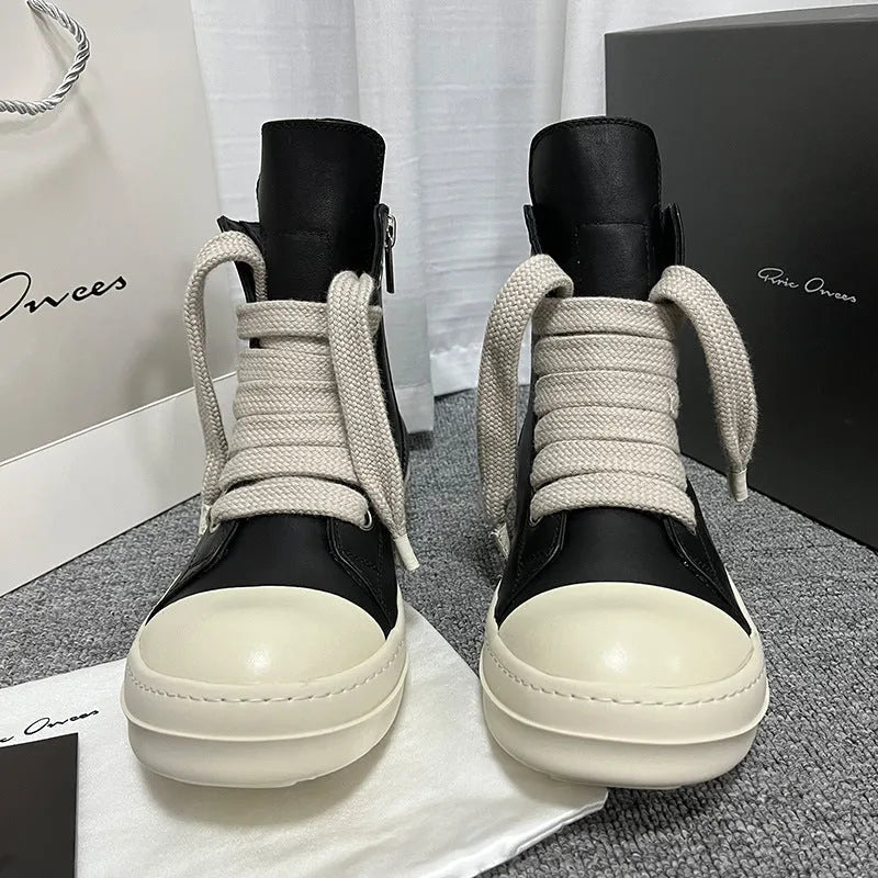 Black genuine leather high-top sneakers with side zipper and platform sole.