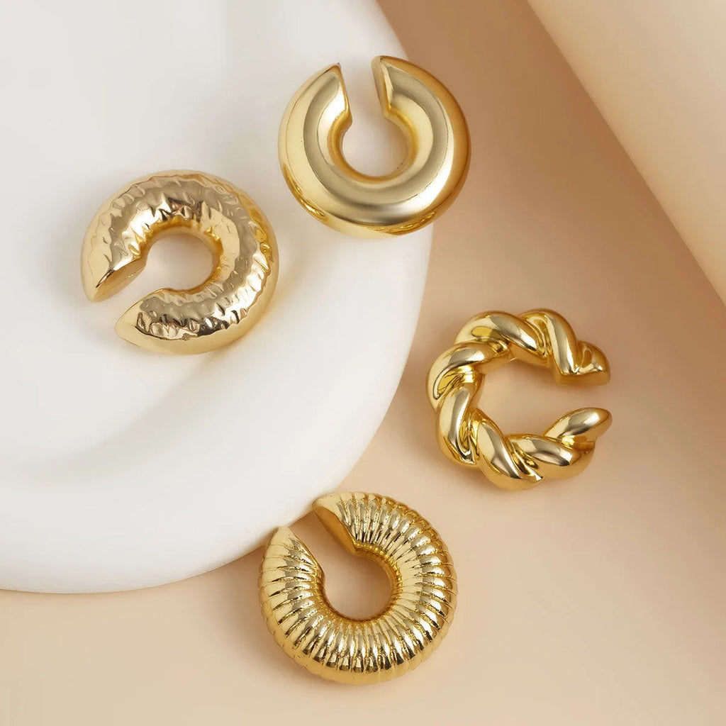 Set of four geometric clip-on earrings in gold and silver finishes for women without pierced ears