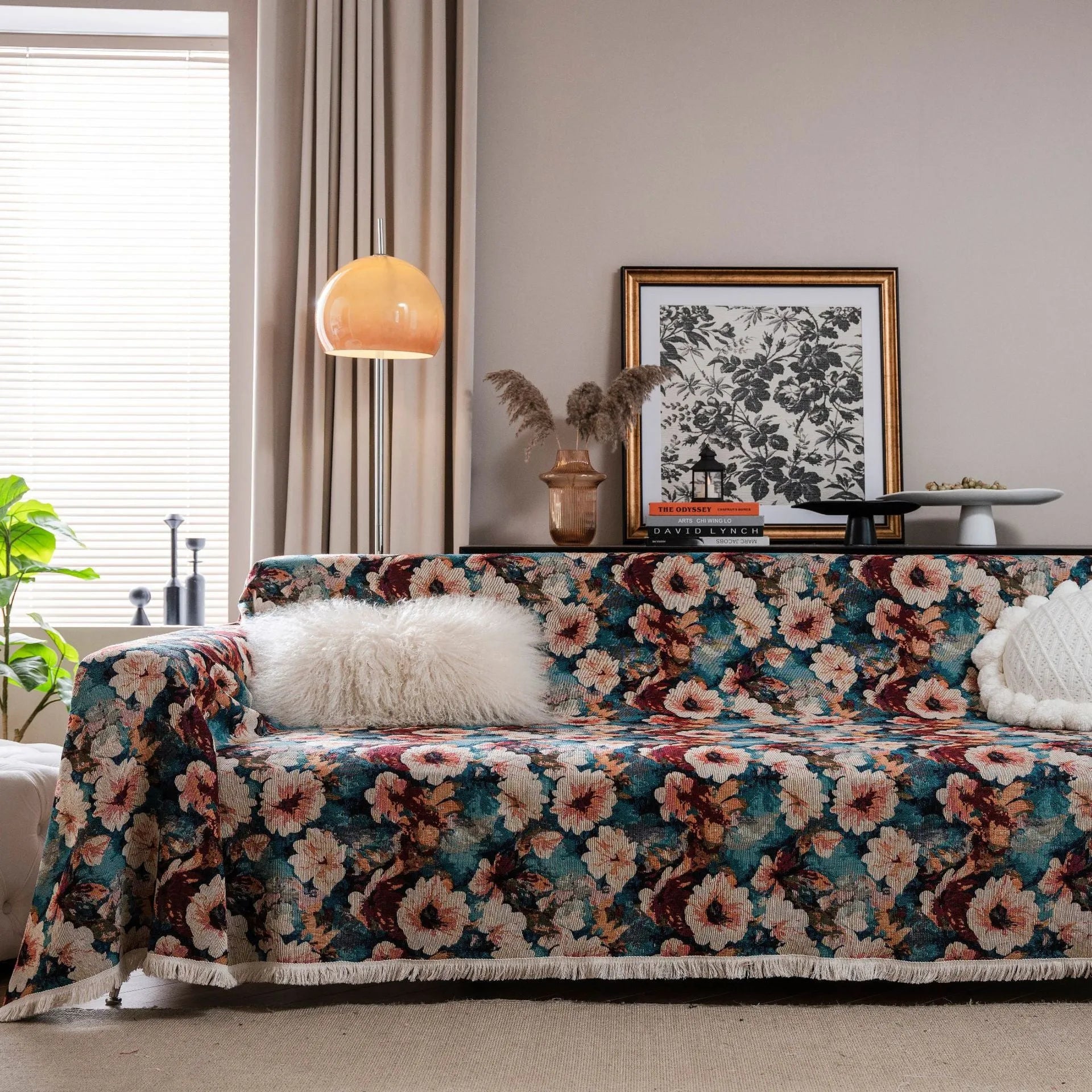 American country retro jacquard sofa cover in a cherry pattern on a white background, draped over a sofa.