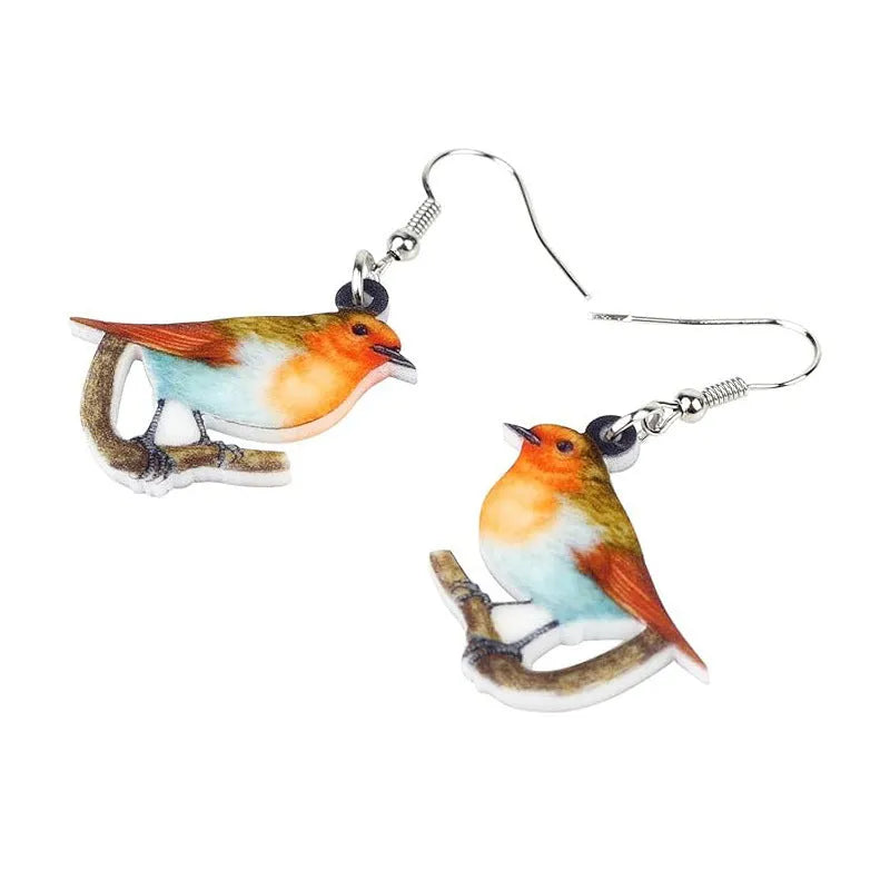 Acrylic blue titmouse bird and snake design pendant earrings on a white background.