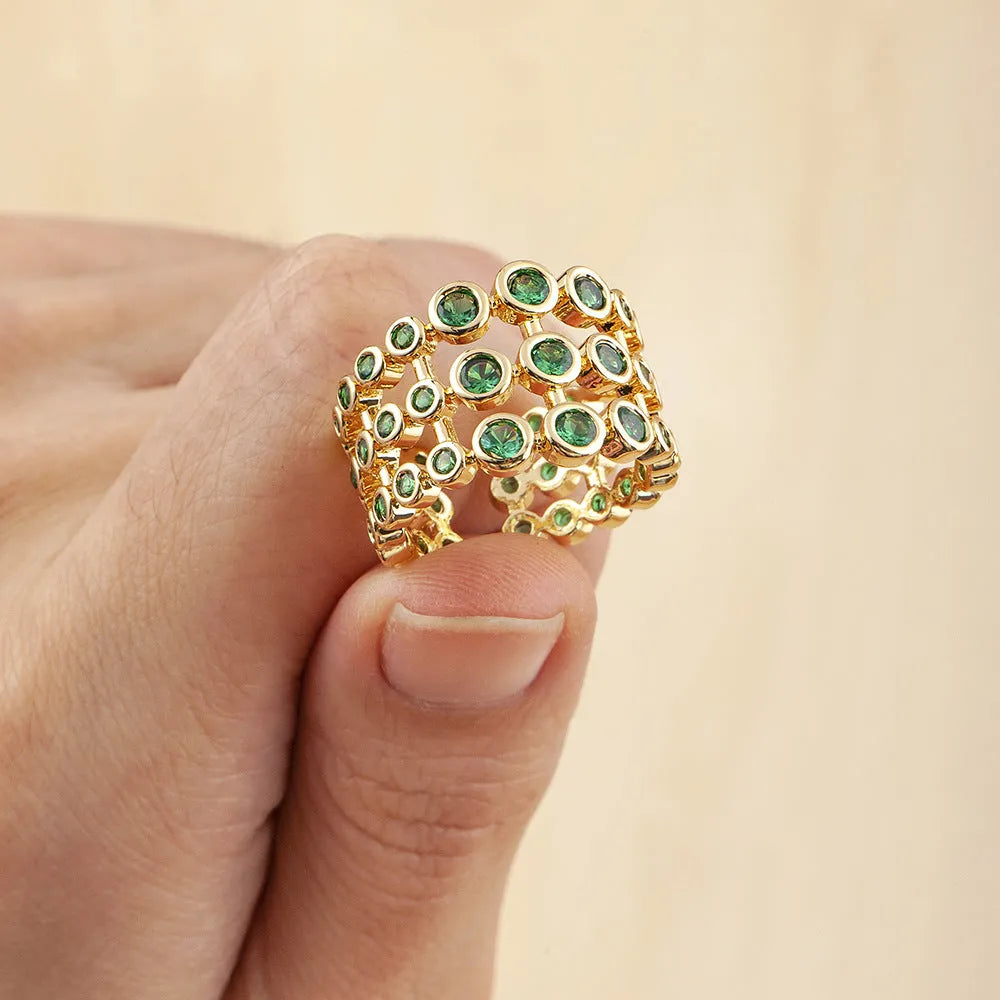 Copper ring with 18K gold plating and green zircon stones in wide band design