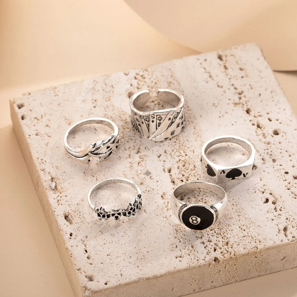 Black alloy ring with a raised spade card design on a band for women.