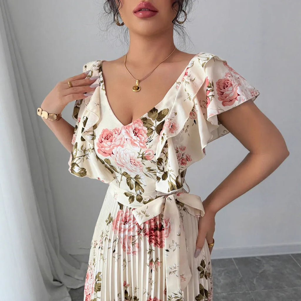 Apricot floral print women's dress with V-neck, ruffle sleeves, and a high-waisted A-line skirt.
