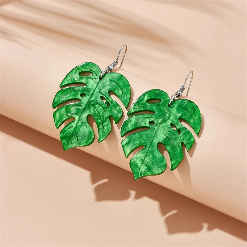 Acrylic drop-shaped earrings with coconut leaf pattern in one of five colours on an alloy hook.