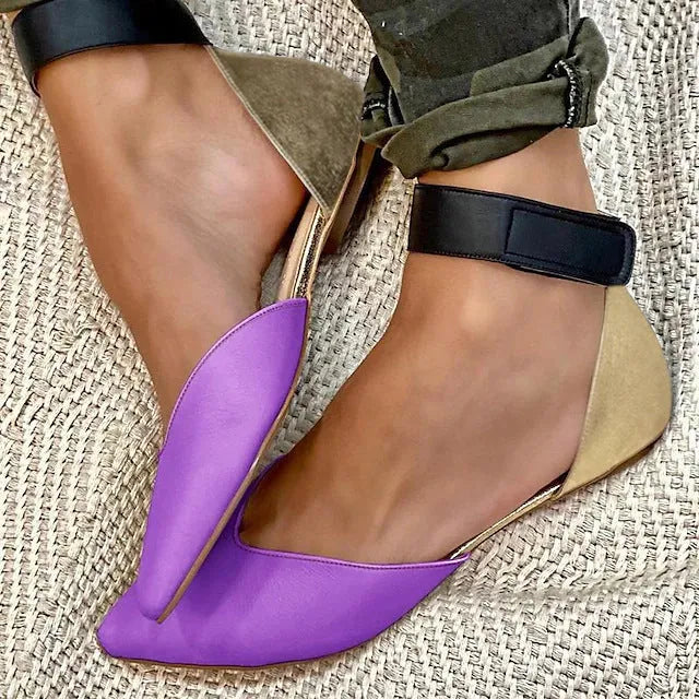 Women's beige velcro sandals with a hollowed upper design and flat heel.
