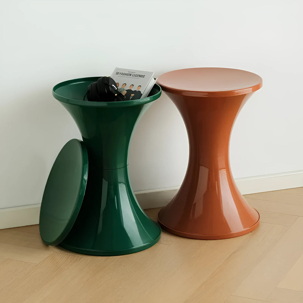 Hourglass-shaped plastic shoe changing stool with a storage seat, shown in green colour.