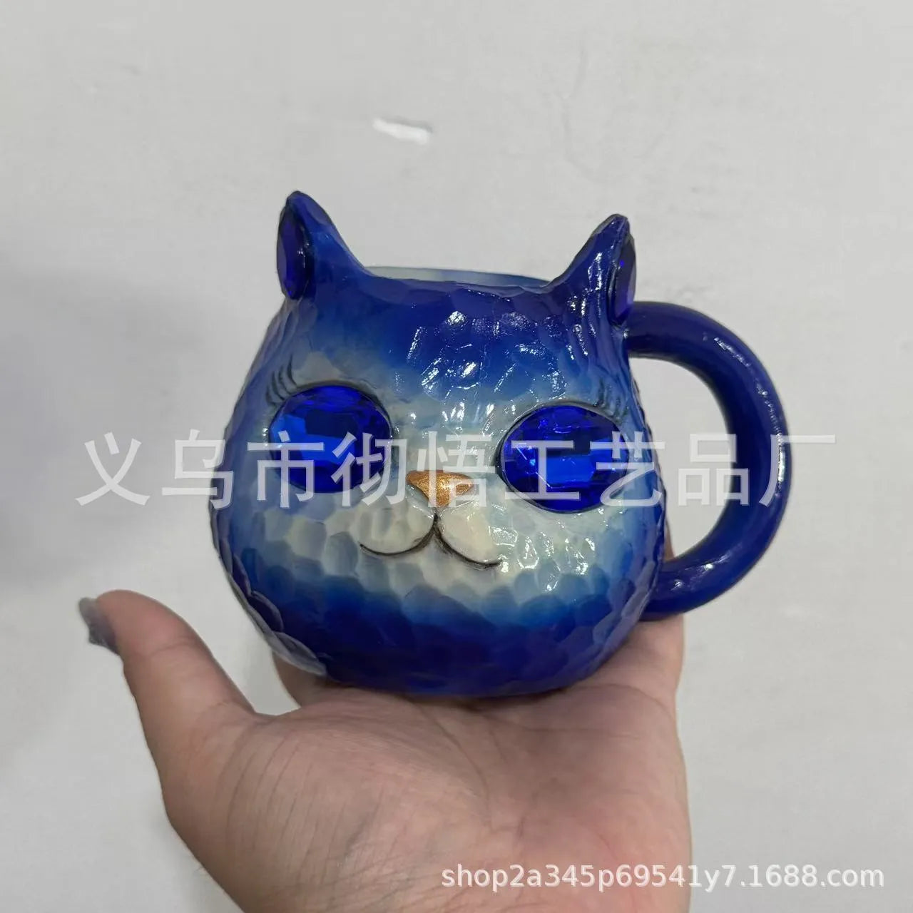 Clear resin Cat Cup ornament in purple, green, blue, and pink colour options on display.