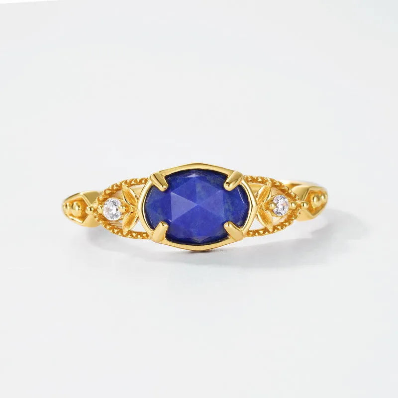 Geometric silver alloy ring with deep blue lapis lazuli stone in elliptical setting