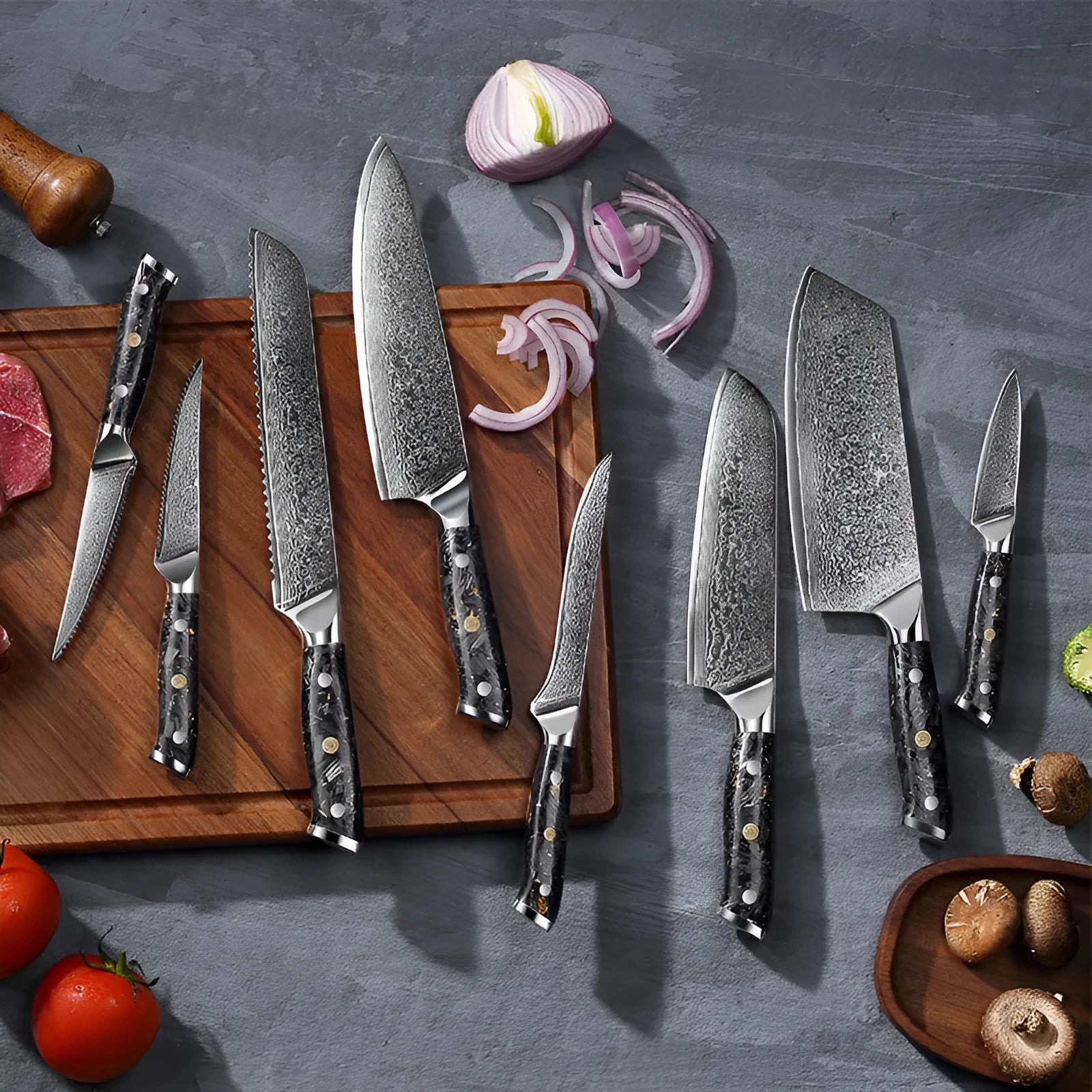 Eight-piece Damascus steel kitchen knife set showing fishbone pattern, including chef, boning, utility, and fruit knives.