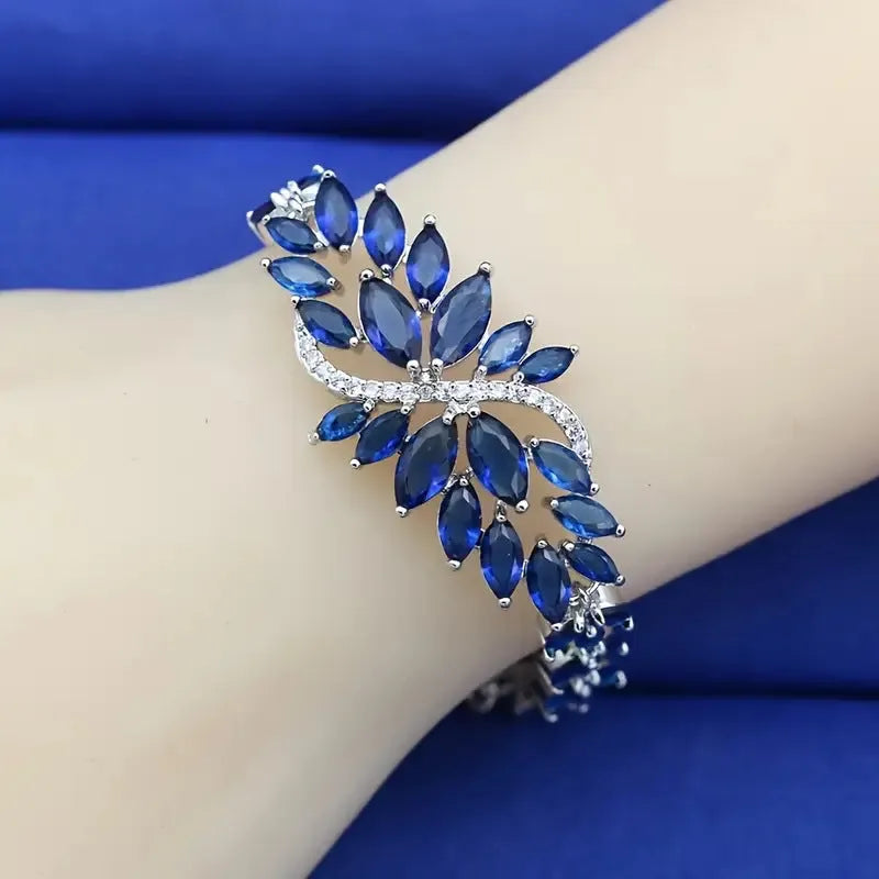 Gold electroplated bracelet with coloured zircon stones and ice flowers pattern on copper.