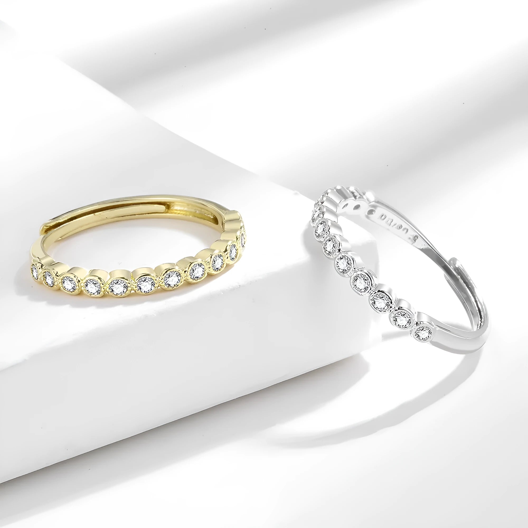 Simple geometric open-mouth ring for women in copper with white gold or yellow gold electroplated finish.