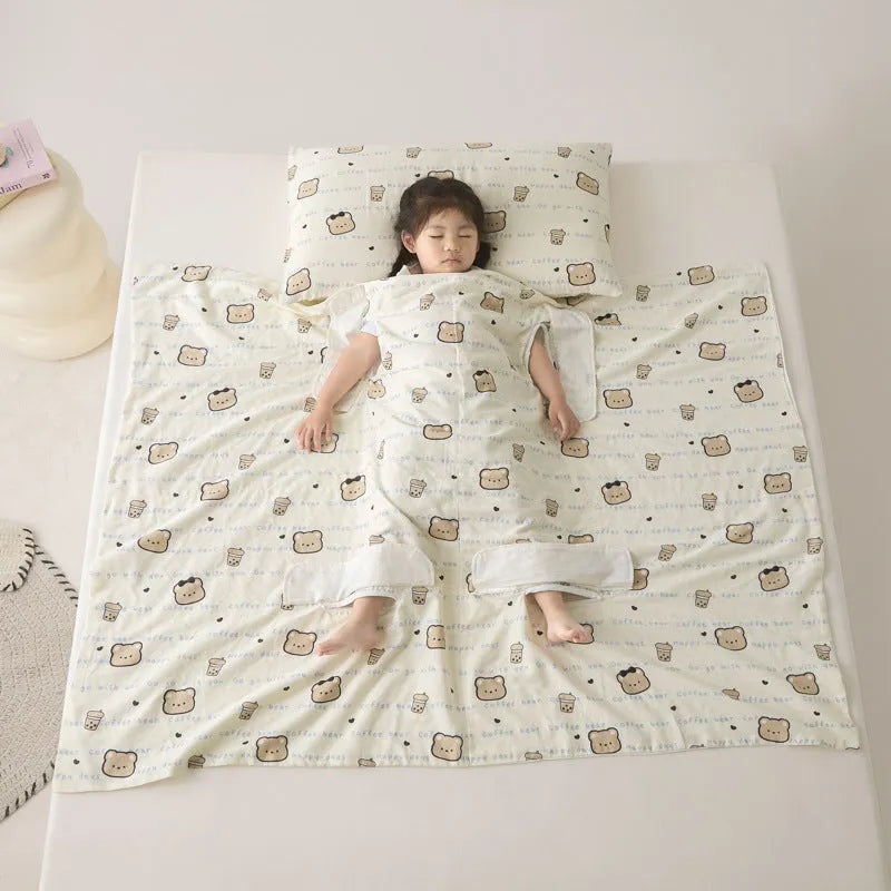 Anti-kick sleeping bag style blanket in a colourful pattern on a bed.