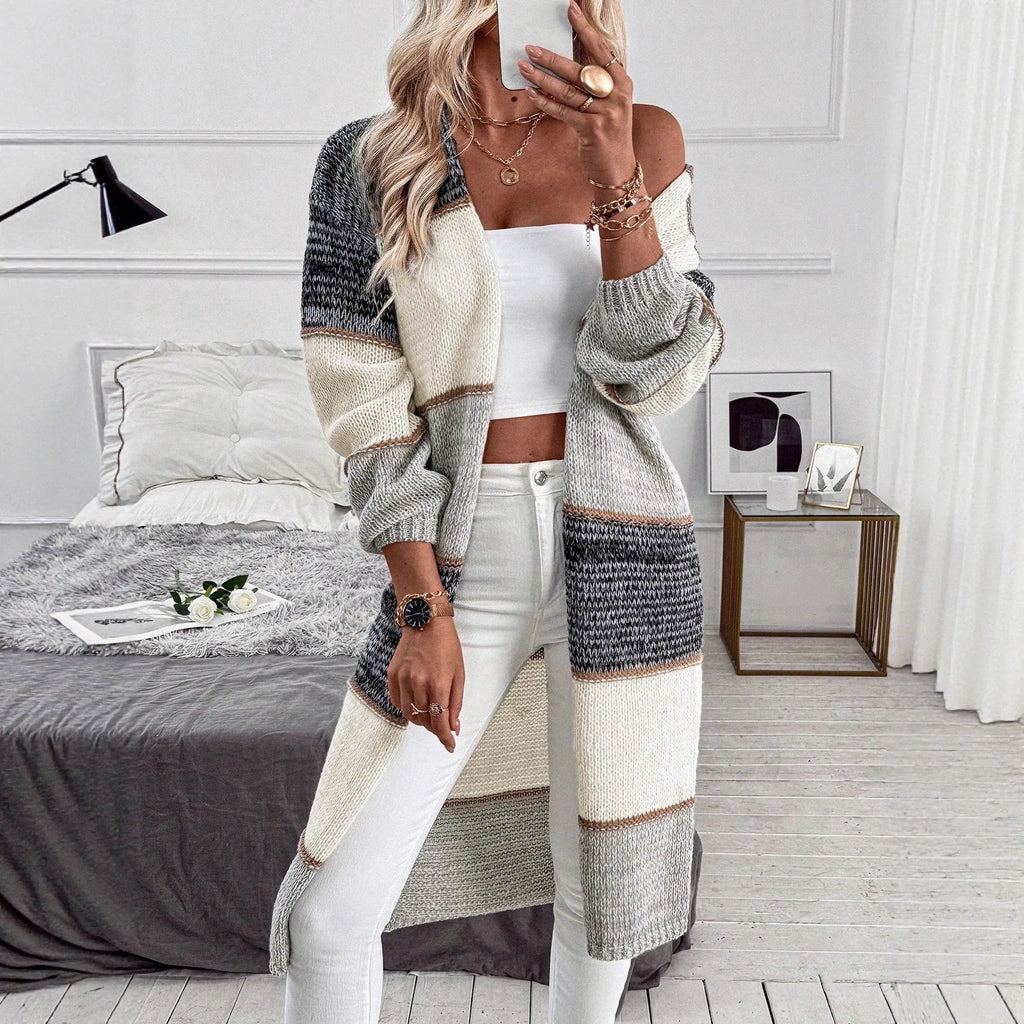 Grey striped knitted women's cardigan with loose fit and long sleeves