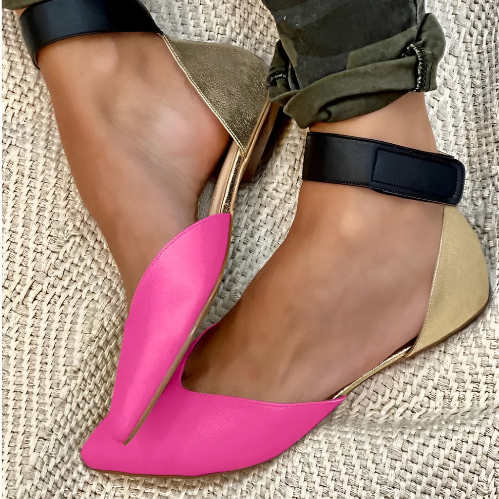 Women's beige velcro sandals with a hollowed upper design and flat heel.