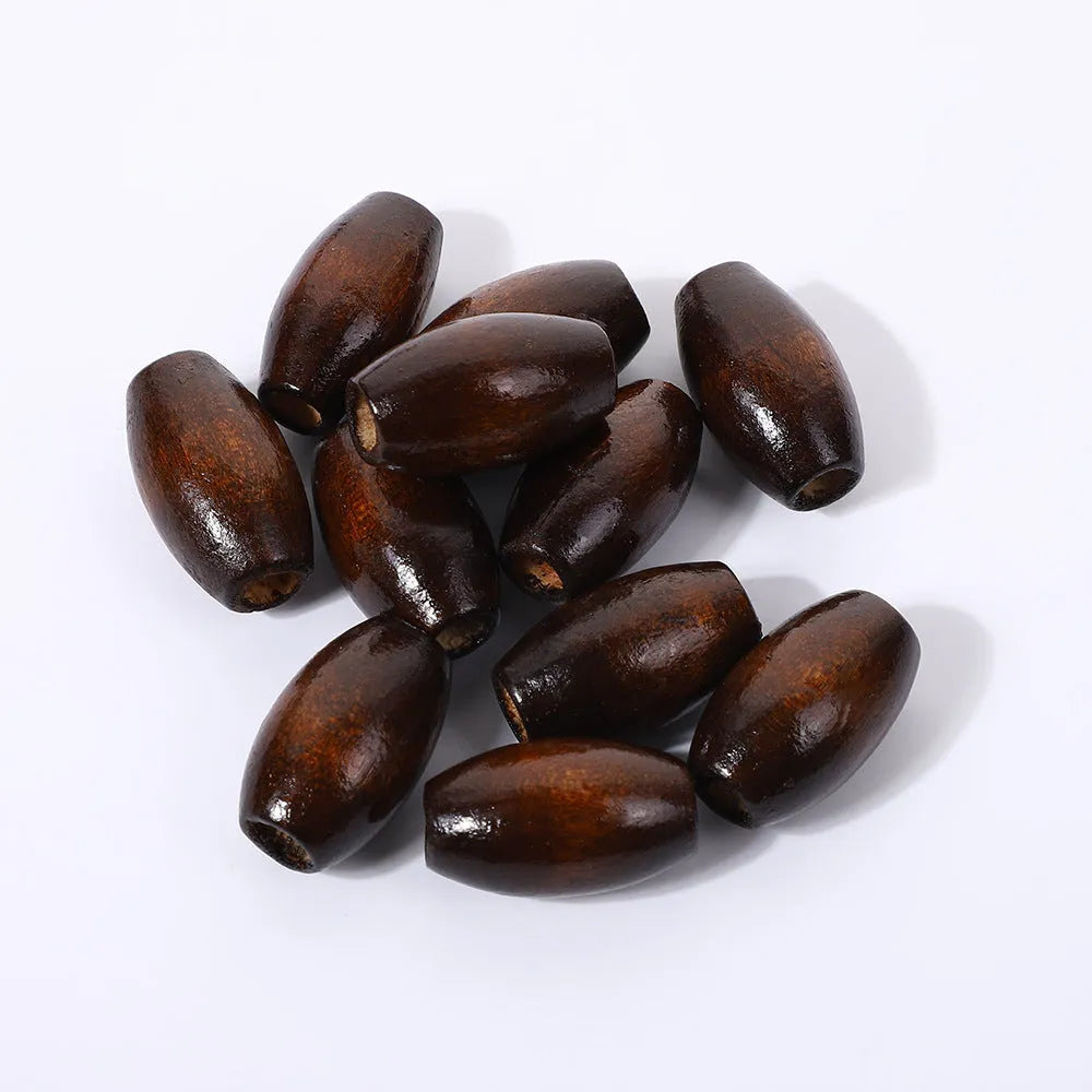 Dark coffee coloured oval wooden bead with M-shaped texture, shown next to a ruler showing 25mm size.