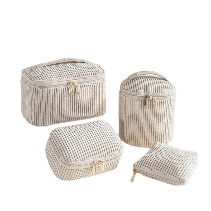 Four cube-shaped flannelette makeup bags in a set, shown in blue with dots colour