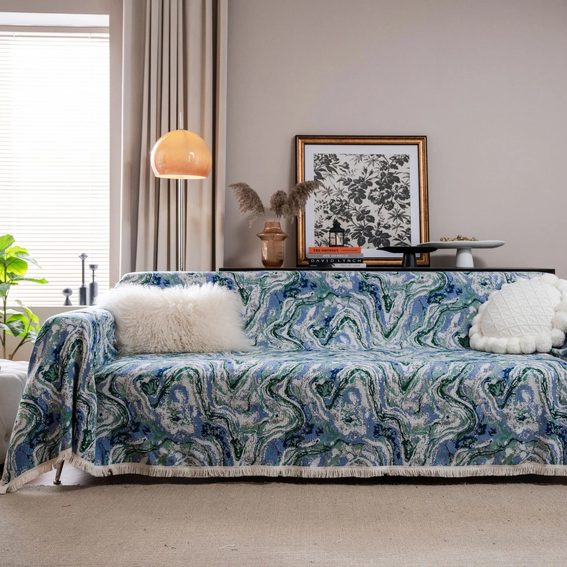American country retro jacquard sofa cover in a cherry pattern on a white background, draped over a sofa.