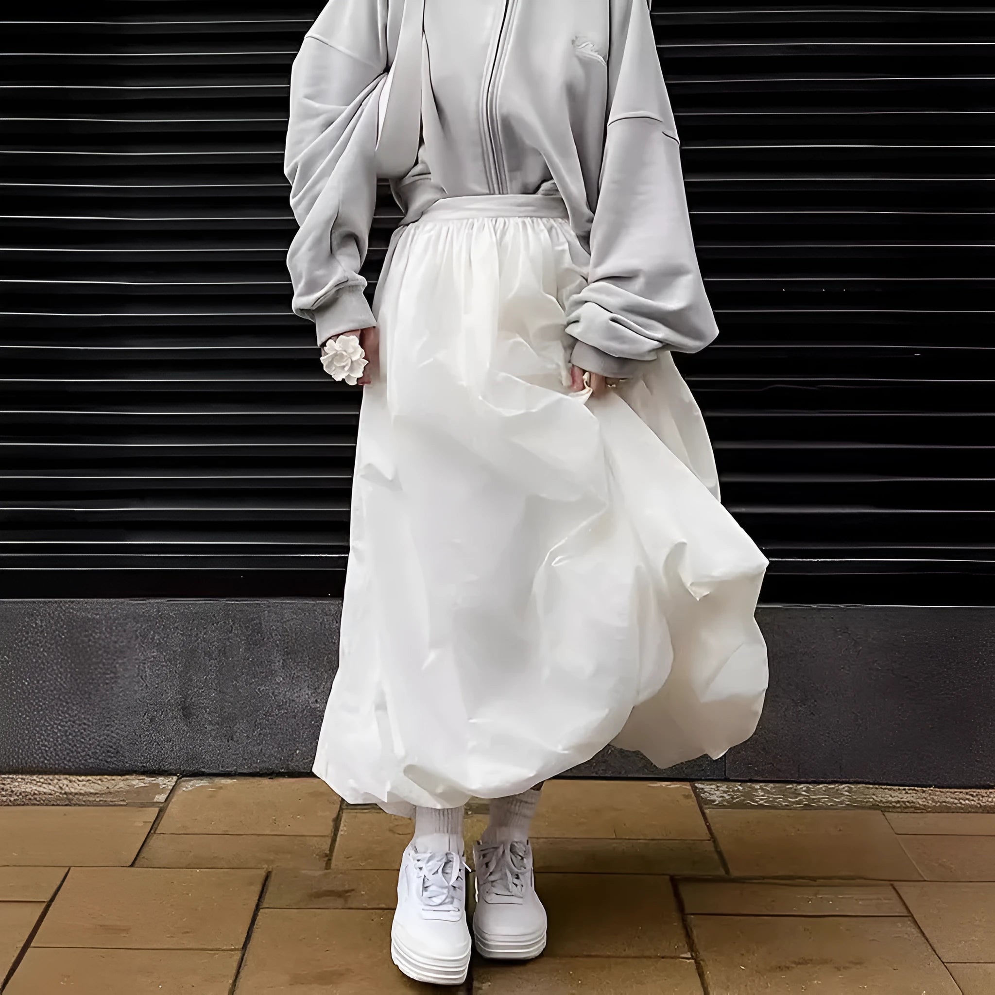 Women's solid colour cotton long skirt shown in black and white options