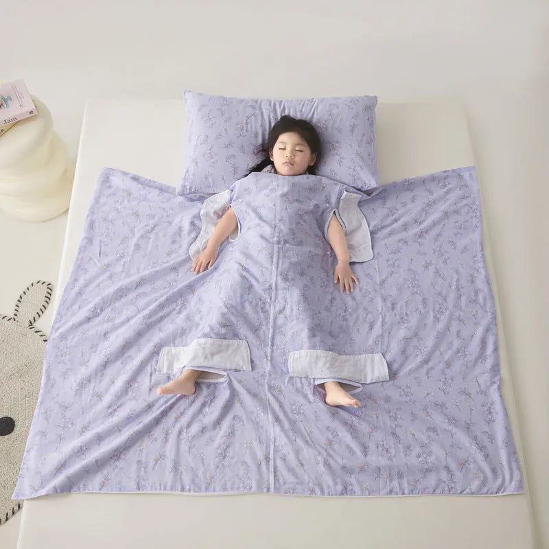 Anti-kick sleeping bag style blanket in a colourful pattern on a bed.