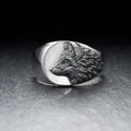 Men's silver alloy ring with a geometric wolf head design on a signet ring band.
