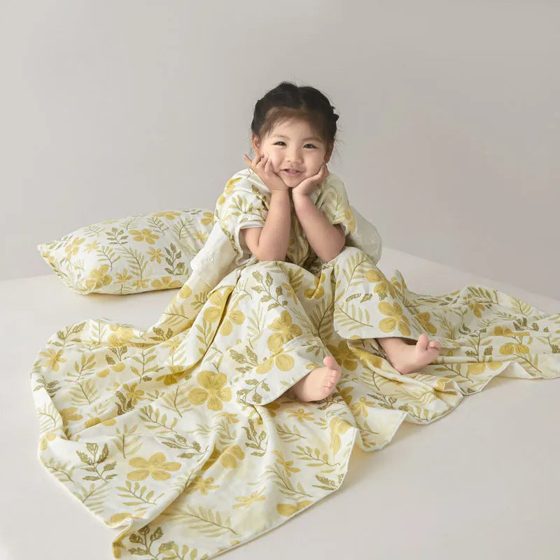 Anti-kick sleeping bag style blanket in a colourful pattern on a bed.