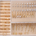 108 geometric alloy earrings with gold and yellow electroplated finishes and round pearl elements