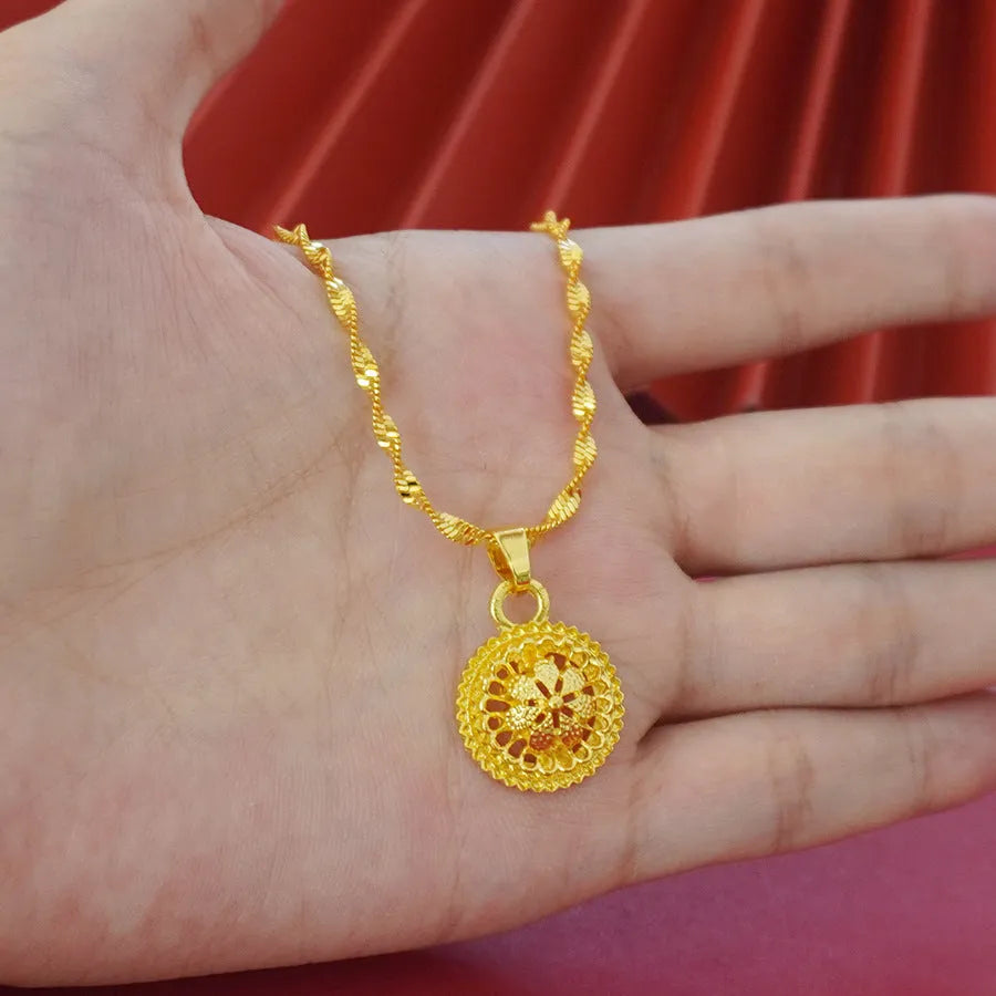 Gold-plated three-piece jewellery set with necklace, earrings, and ring featuring floral design patterns