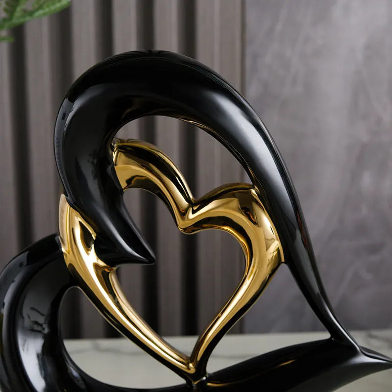 Modern white porcelain heart ornament with a geometric shape on a wooden surface.