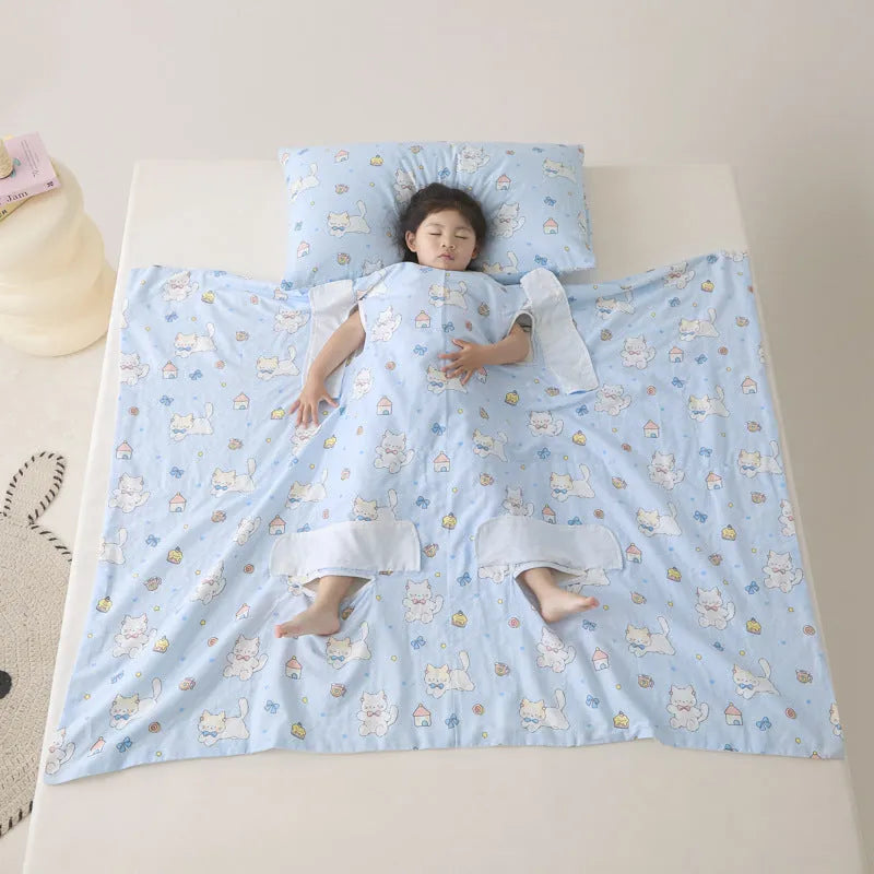 Anti-kick sleeping bag style blanket in a colourful pattern on a bed.