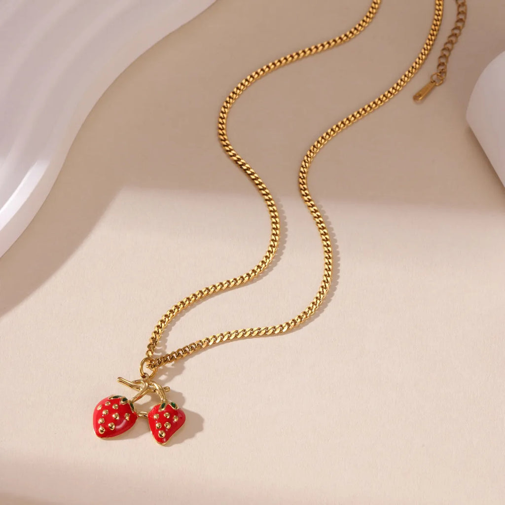 Women's summer strawberry fruit pendant necklace in red or white gradient on a steel chain.