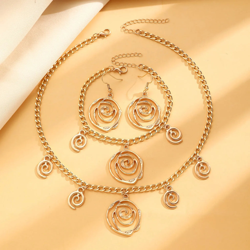 Spiral donut alloy jewellery set with necklace, bracelet, and earrings in gold or silver electroplated finish