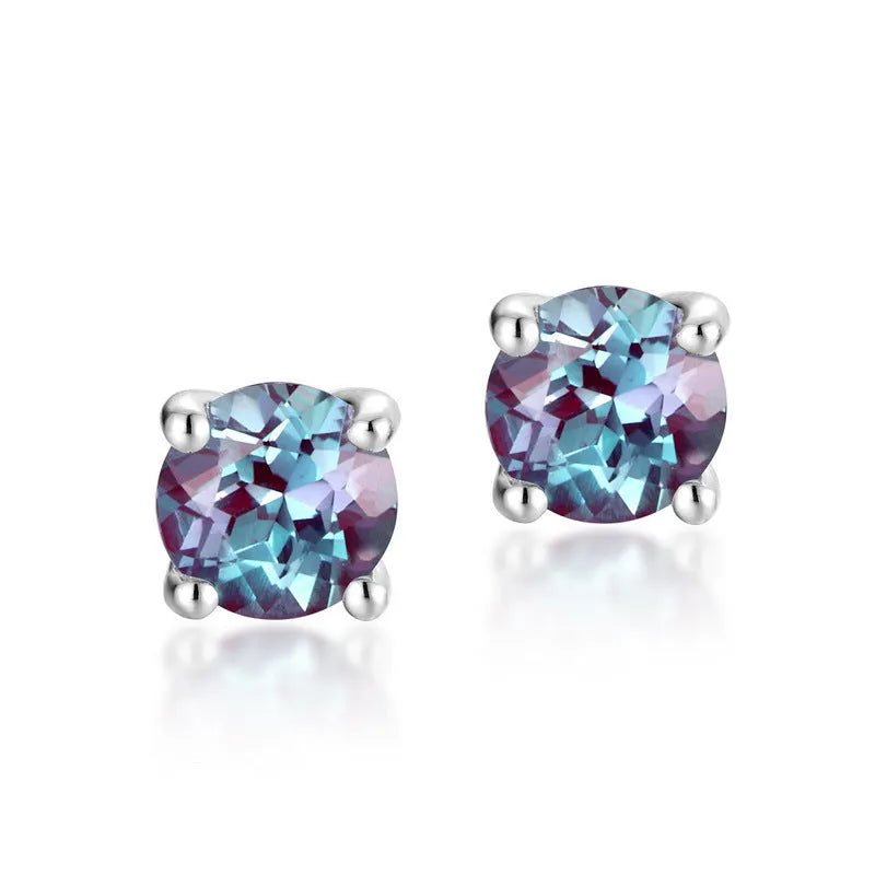 A pair of simple geometric 925 silver ear studs with round cultivated alexandrite stones.