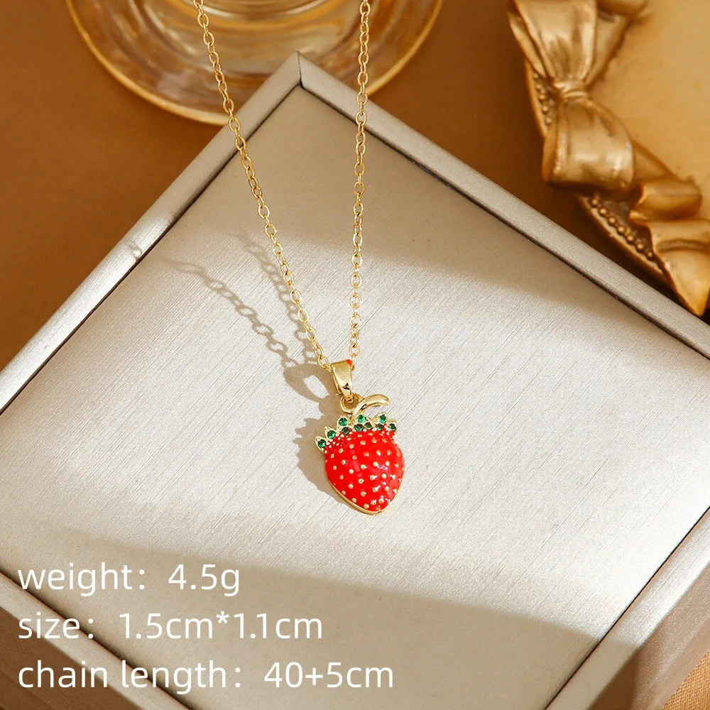 Titanium steel delicate necklace with indie cherry, strawberry, and pepper charms on an O-ring chain, shown in golden and steel colour variations.
