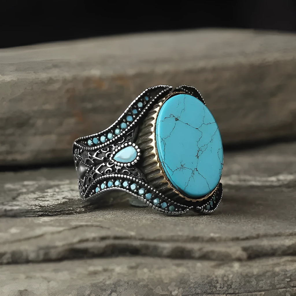 Men's turquoise round ring with antique silver finish shown in UK size 10