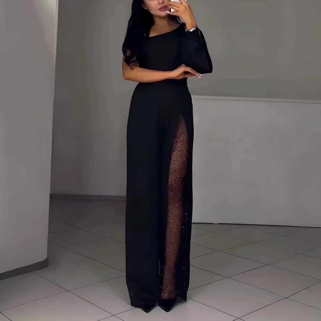 Black women's jumpsuit with an oblique off-the-shoulder neckline and a high slit on the leg.