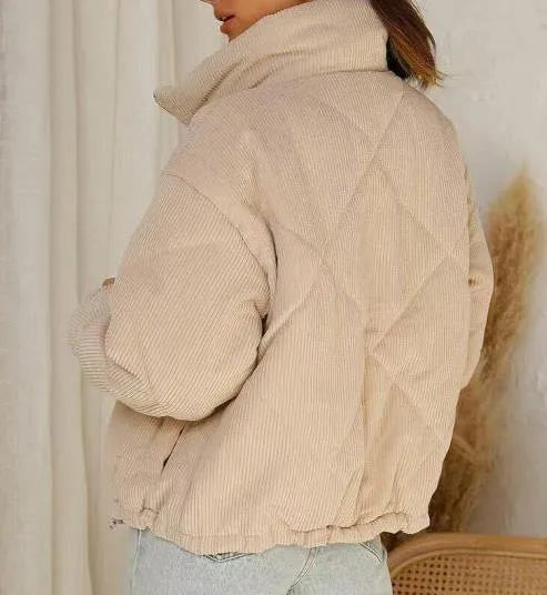 Women's apricot corduroy jacket with stand collar and front zipper on mannequin