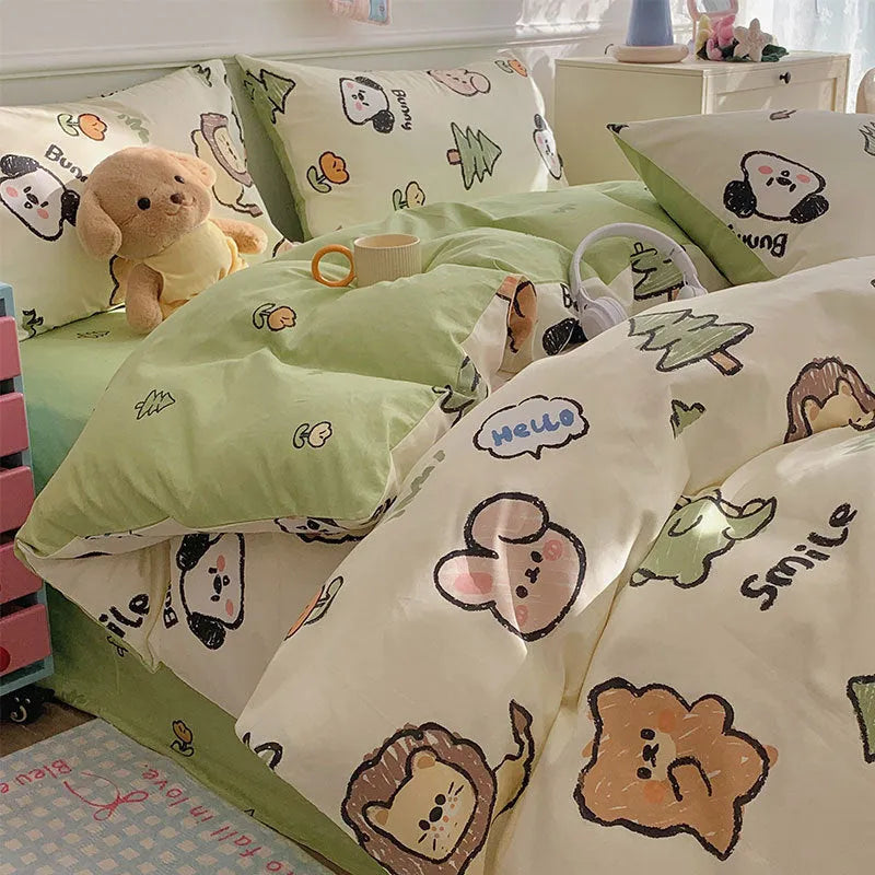 Cartoon dog pattern pure cotton duvet cover and pillowcases from a four-piece bedding set laid on a bed.