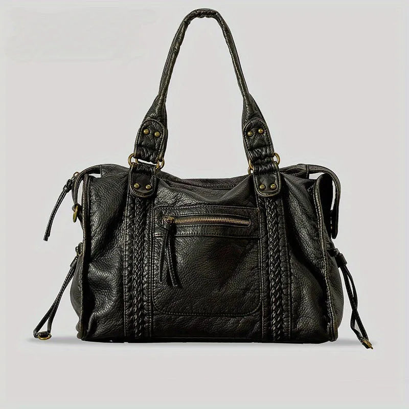 Women's European retro motorcycle messenger bag in bright black with golden edge showing weaving details and shoulder strap