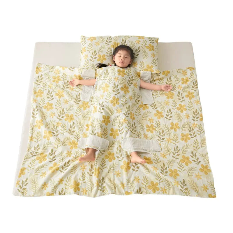 Anti-kick sleeping bag style blanket in a colourful pattern on a bed.