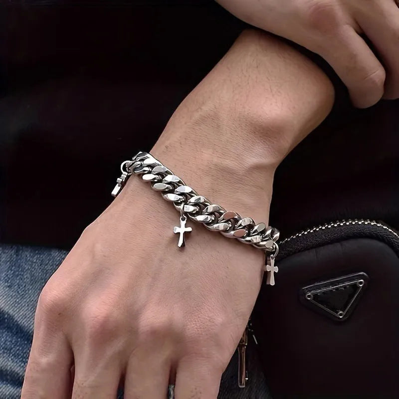 Men's titanium steel bracelet showing a geometric cross design on a simple band.