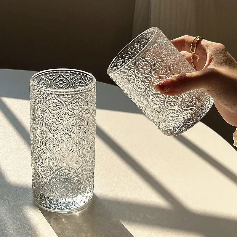 A begonia-carved straight round glass water cup in a solid colour, shown in short 250ml and tall 380ml sizes.